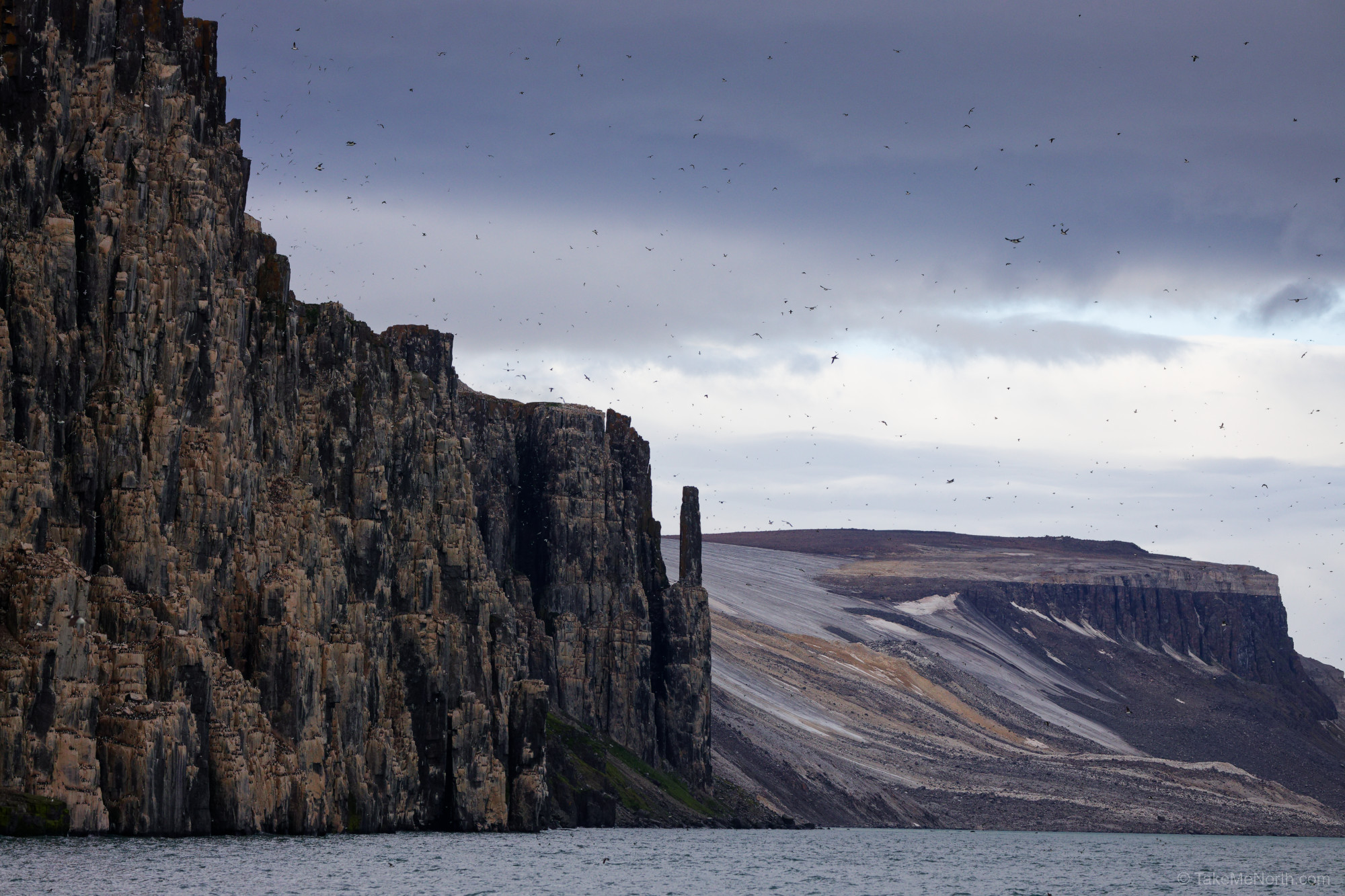 The steep cliffs of Alkefjellet in summer